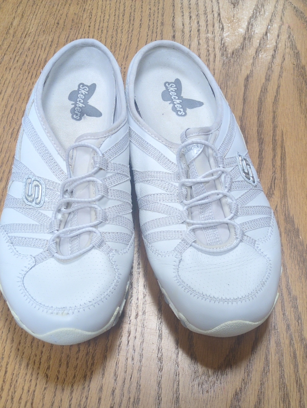 Skechers Women's White Slip-On Athletic Sneakers with Elastic Bungee Detailing